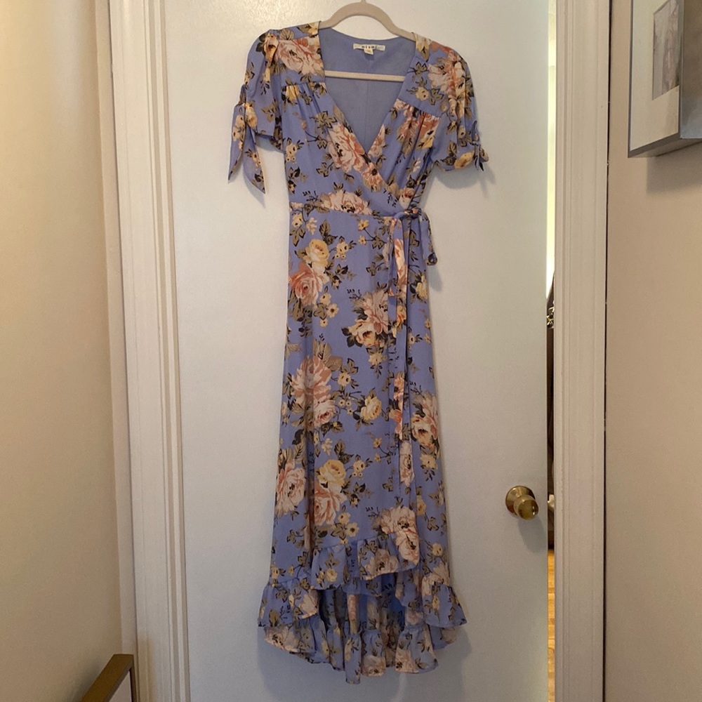 Floral blue maxi dress with mini ruffle at the bottom.